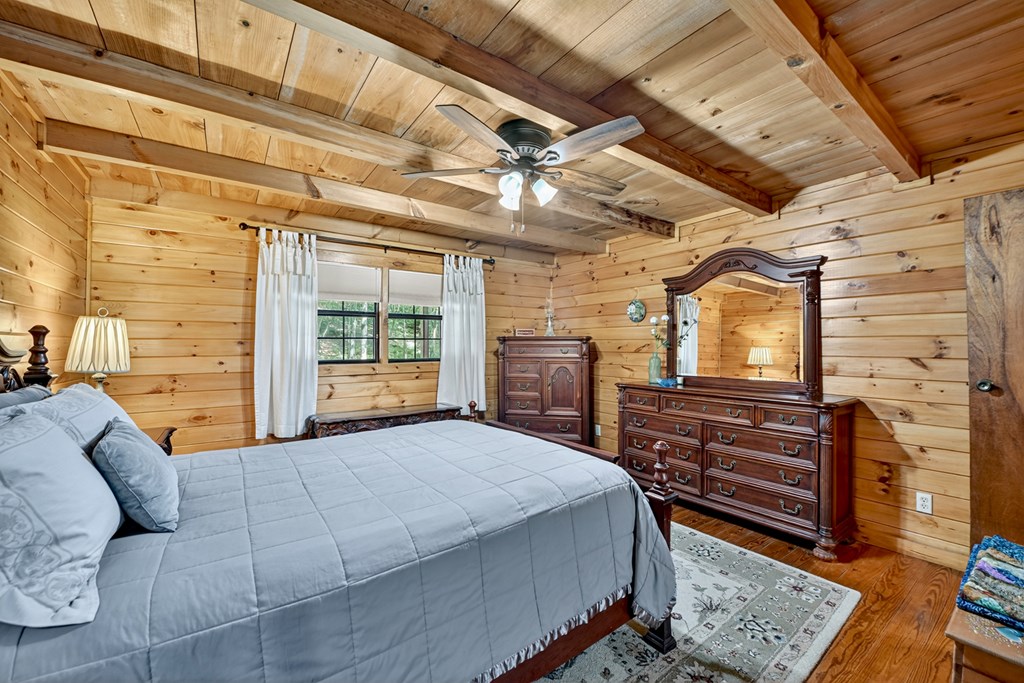 1431 Cashes Valley Lane Cherry Log, GA 30522 - Photo 3 of 57 a bedroom with a bed next to a window