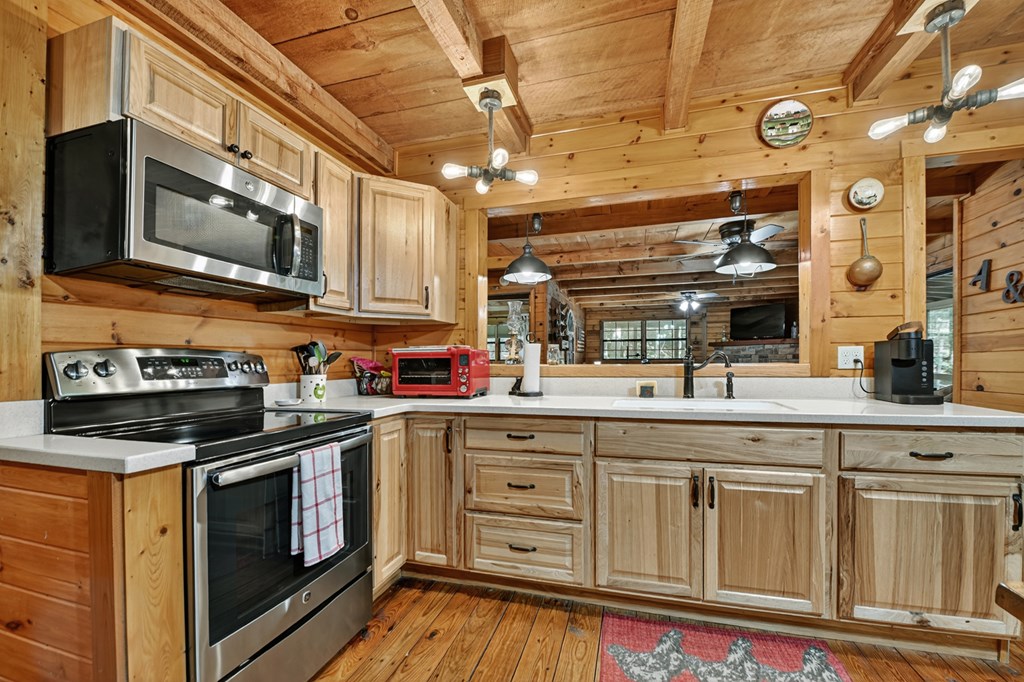 1431 Cashes Valley Lane Cherry Log, GA 30522 - Photo 40 of 57 a kitchen with stainless steel appliances granite countertop a stove and a microwave