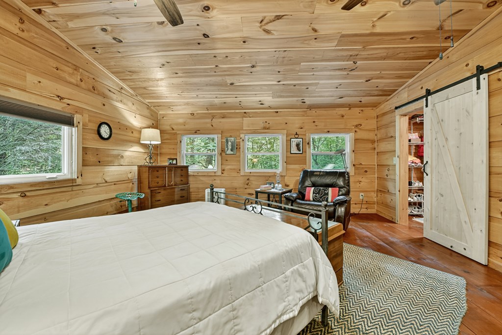 1431 Cashes Valley Lane Cherry Log, GA 30522 - Photo 52 of 57 a bed room with a bed and a large window