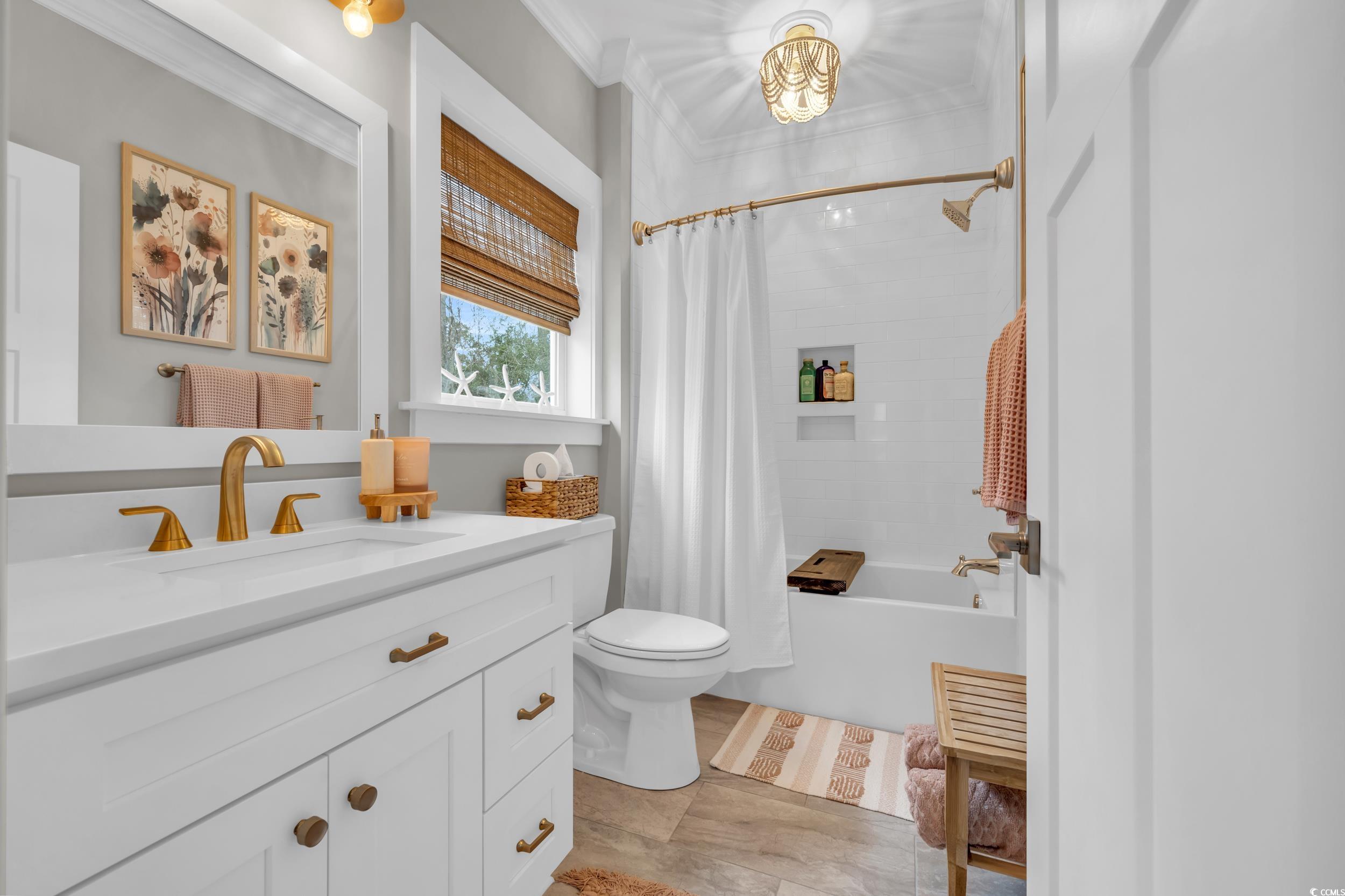 22 Trigger Fish Lane Murrells Inlet, SC 29576 - Photo 23 of 39 Full bathroom featuring shower / bath combination with curtain, vanity, toilet, and ornamental molding