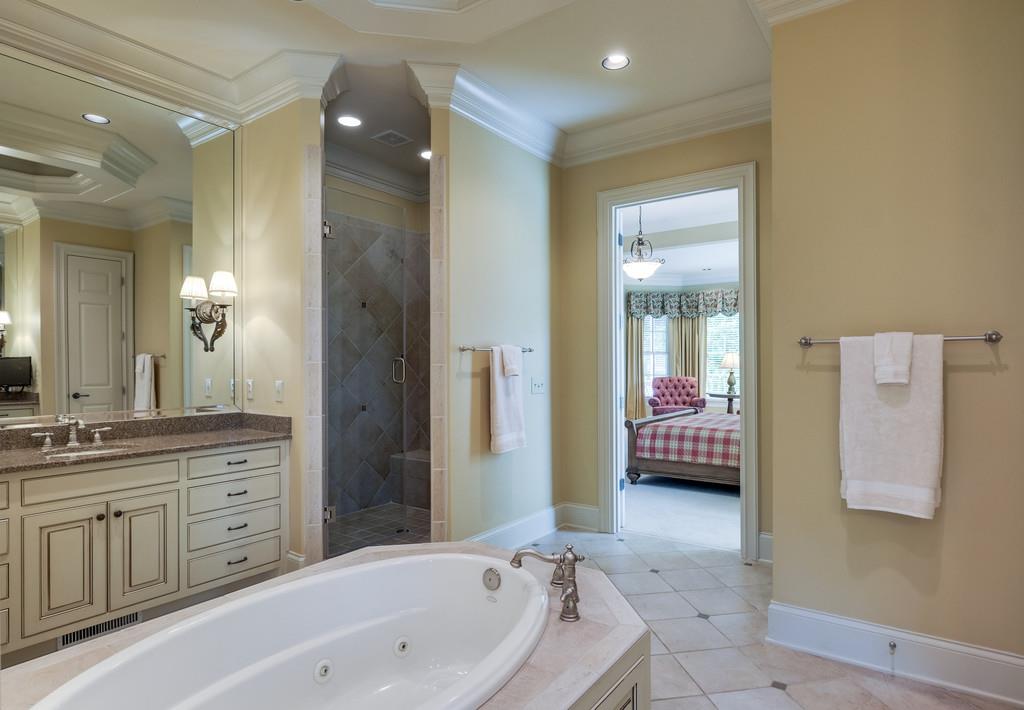 1201 Talon Way Franklin, TN 37069 - Photo 18 of 30 a spacious bathroom with a tub sink and mirror