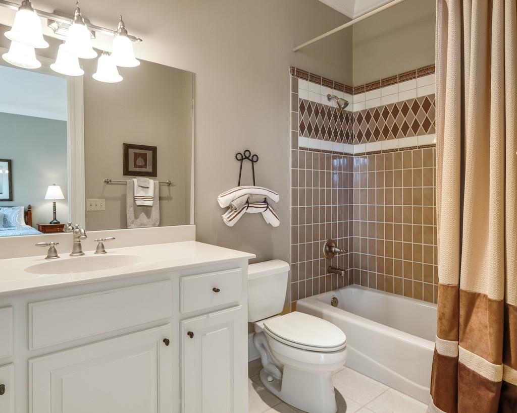 1201 Talon Way Franklin, TN 37069 - Photo 19 of 30 a bathroom with a sink a toilet and shower