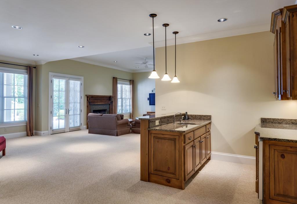 1201 Talon Way Franklin, TN 37069 - Photo 25 of 30 a kitchen with stainless steel appliances granite countertop a stove and a refrigerator