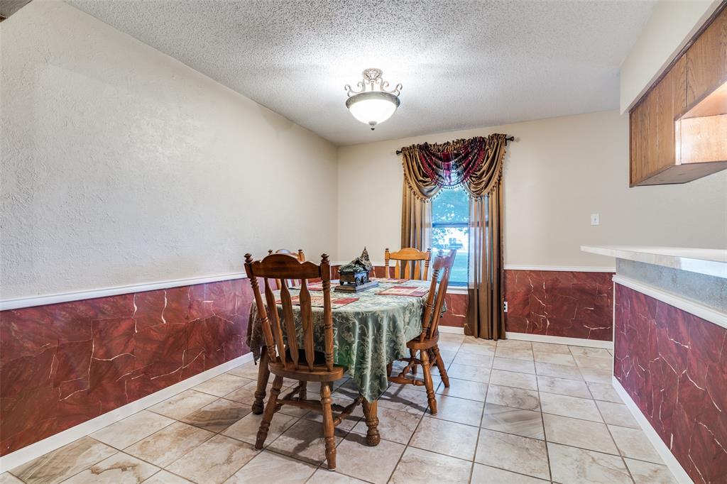 805 Paul Wilson Road Wylie, TX 75098 - Photo 14 of 38 Dining area is large enough to accommodate friends and family.