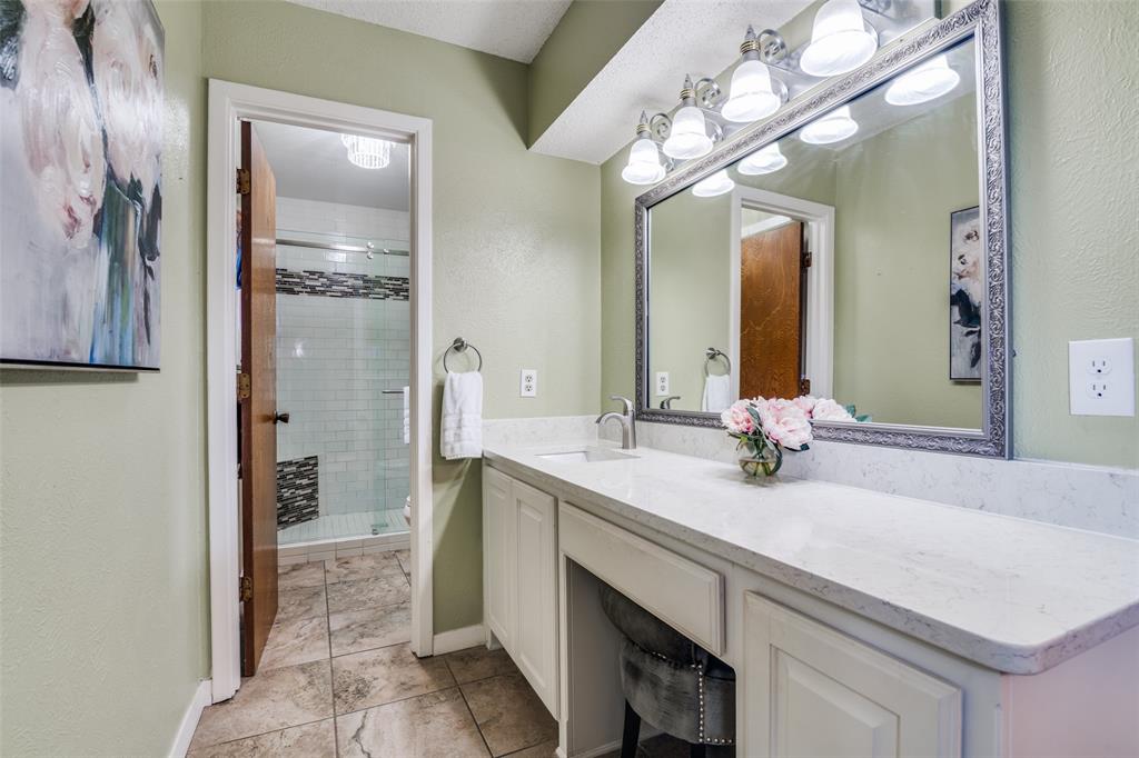 805 Paul Wilson Road Wylie, TX 75098 - Photo 19 of 38 Primary updated bathroom includes a vanity, separate water closet, and tile flooring.