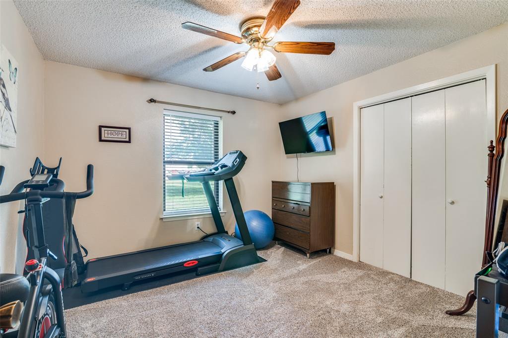 805 Paul Wilson Road Wylie, TX 75098 - Photo 21 of 38 Guest rooms all have ceiling fans, ample closet space, and recent carpet.