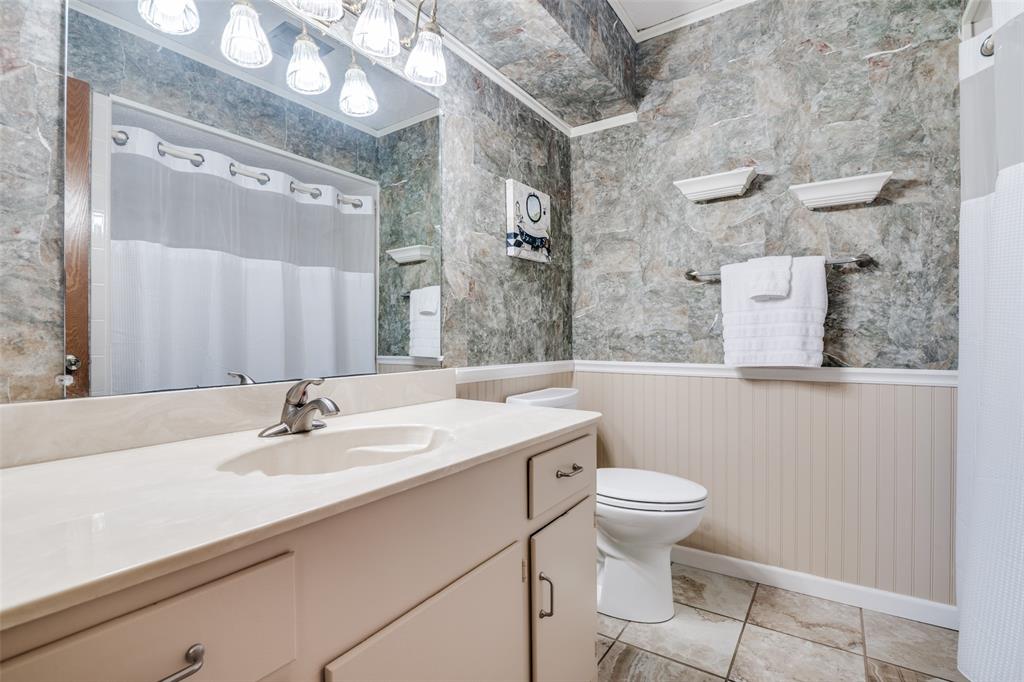 805 Paul Wilson Road Wylie, TX 75098 - Photo 23 of 38 Guest bathroom with tile flooring and full tub and shower combo.