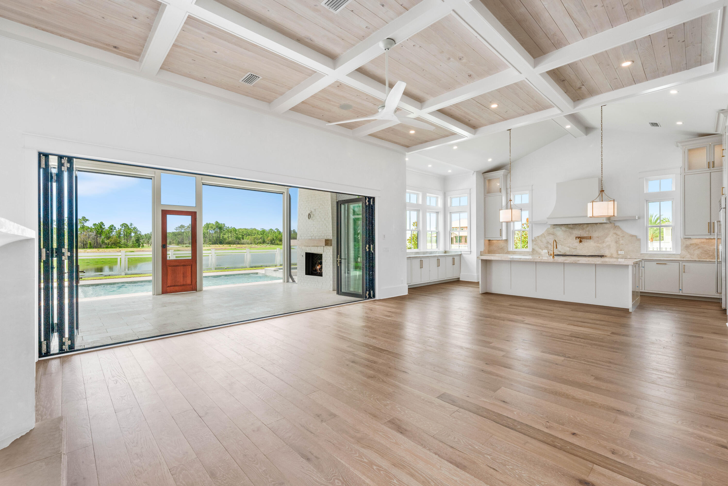 65 Morning Lgt Way Watersound, FL 32461 - Photo 12 of 59 a view of a kitchen with a stove and a large window