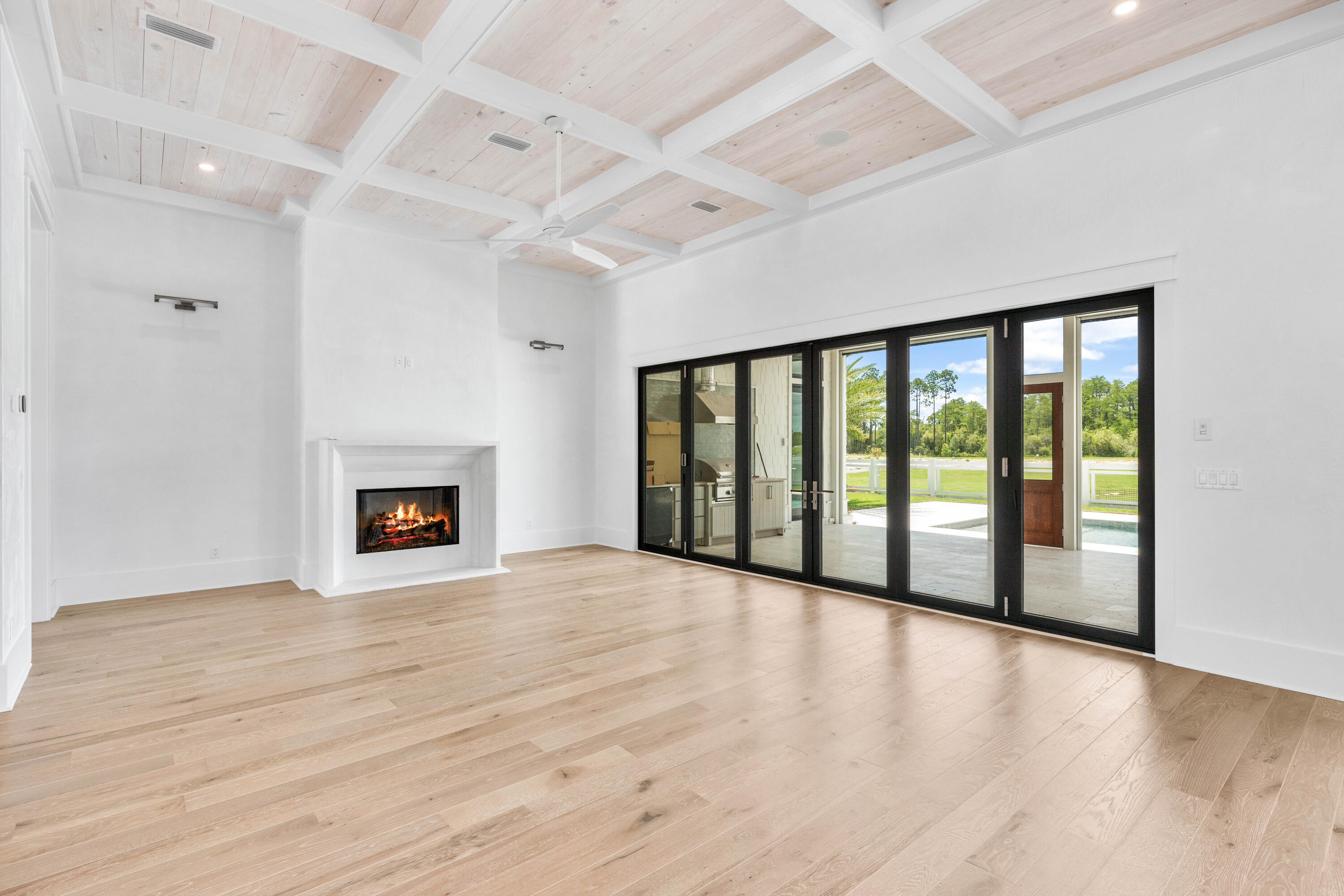 65 Morning Lgt Way Watersound, FL 32461 - Photo 13 of 59 a view of an empty room with wooden floor and a window
