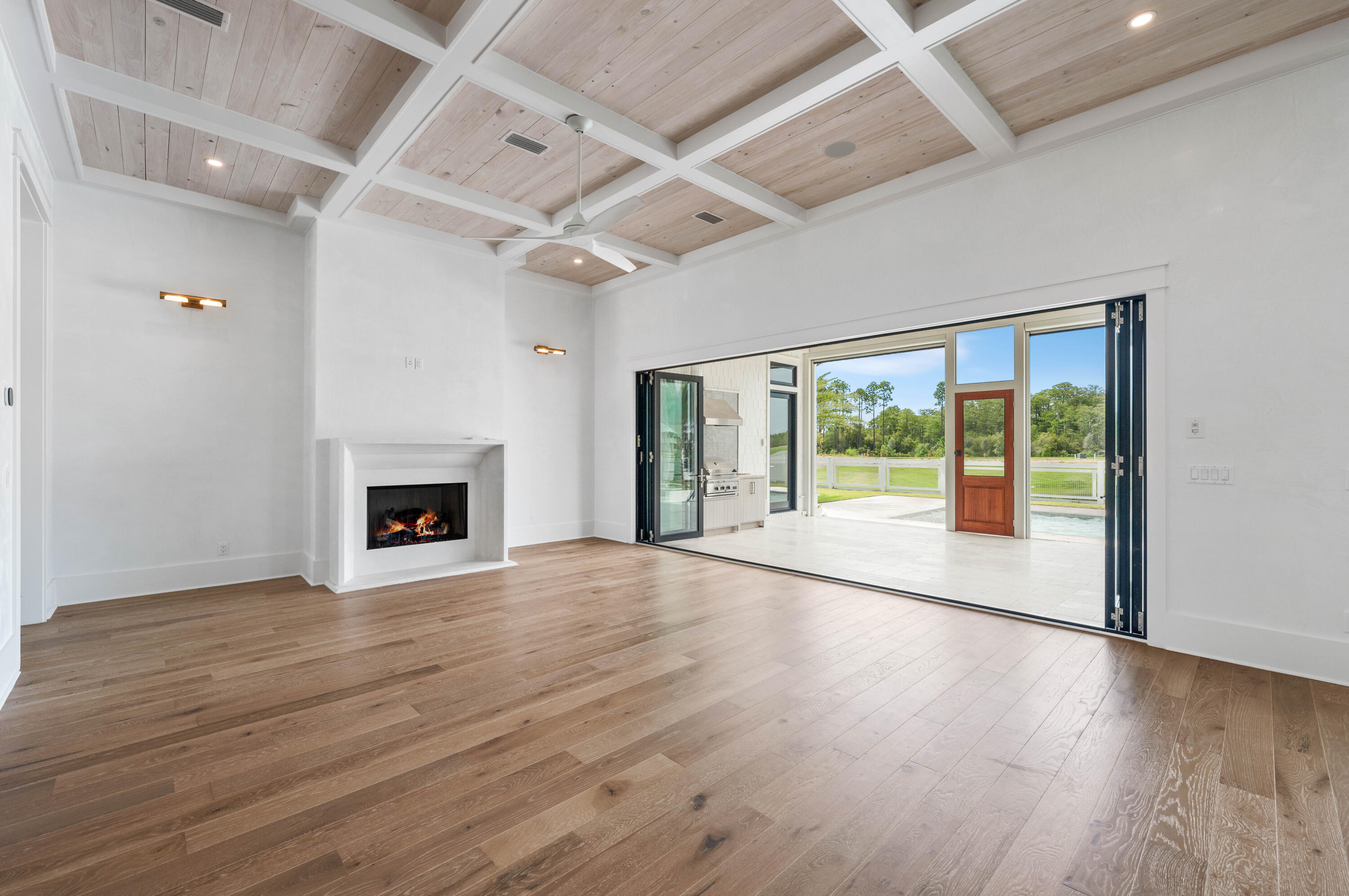 65 Morning Lgt Way Watersound, FL 32461 - Photo 14 of 59 a view of empty room with wooden floor and fireplace