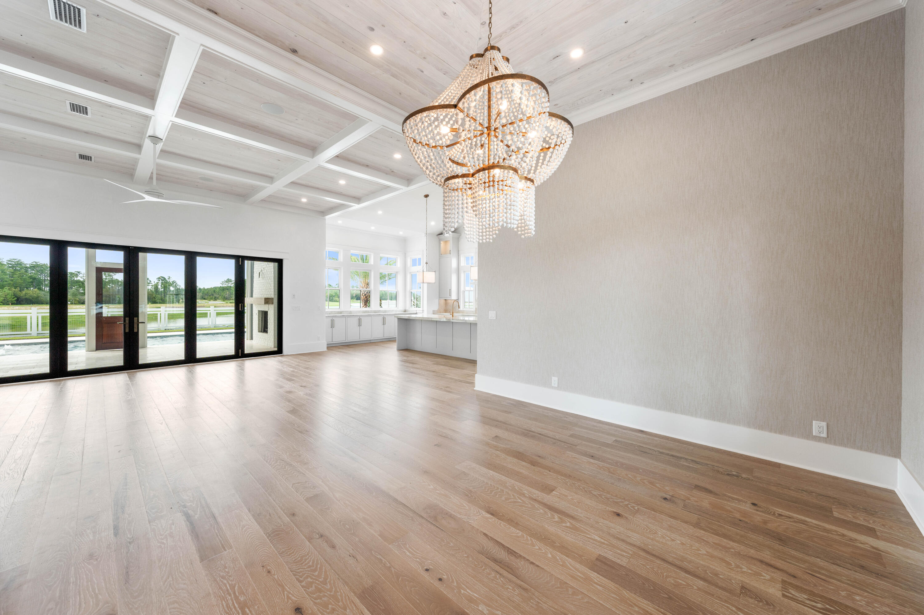 65 Morning Lgt Way Watersound, FL 32461 - Photo 15 of 59 a view of an empty room with wooden floor and a window