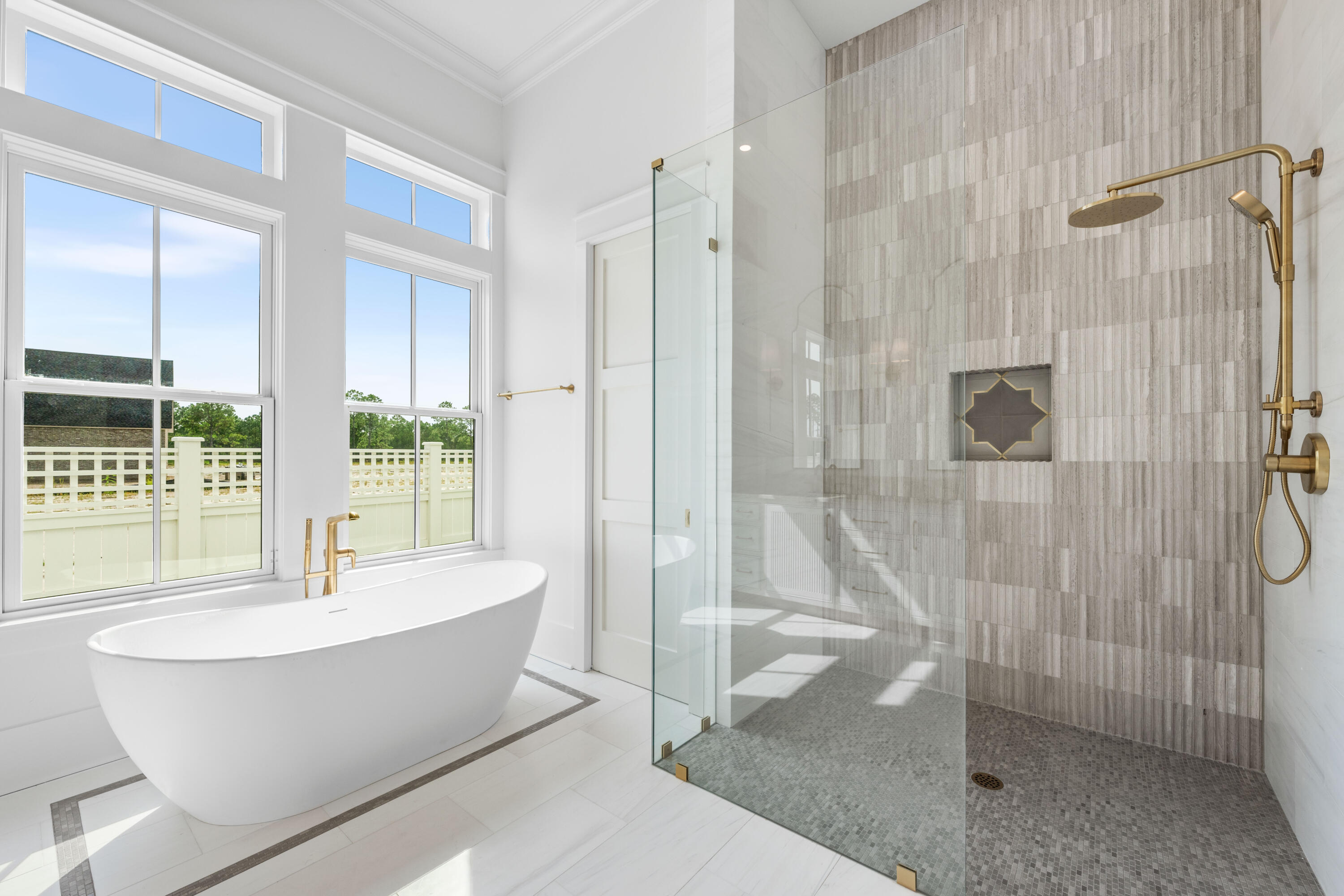 65 Morning Lgt Way Watersound, FL 32461 - Photo 19 of 59 a bathroom with a bathtub and shower