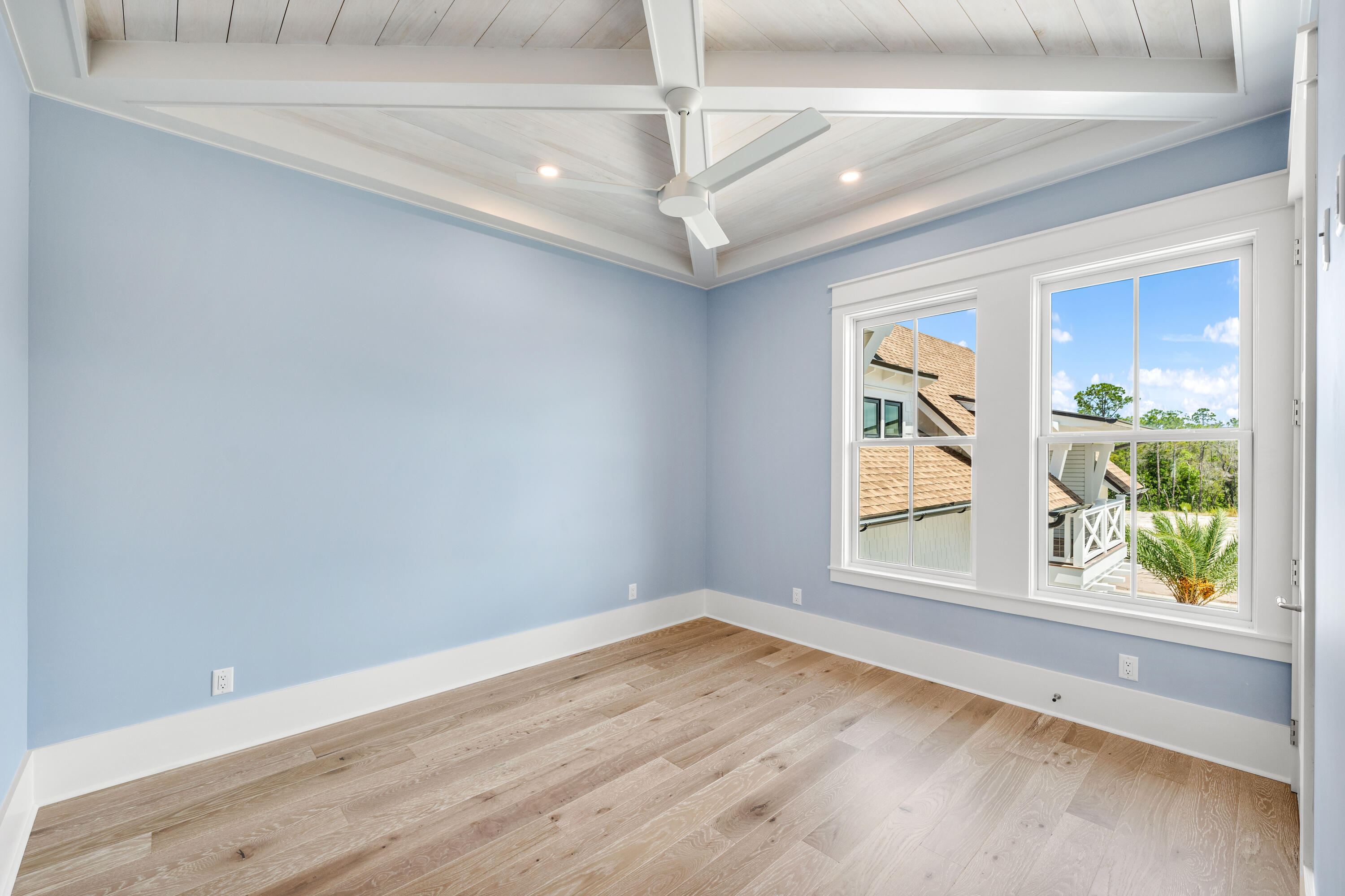 65 Morning Lgt Way Watersound, FL 32461 - Photo 23 of 59 an empty room with wooden floor and windows