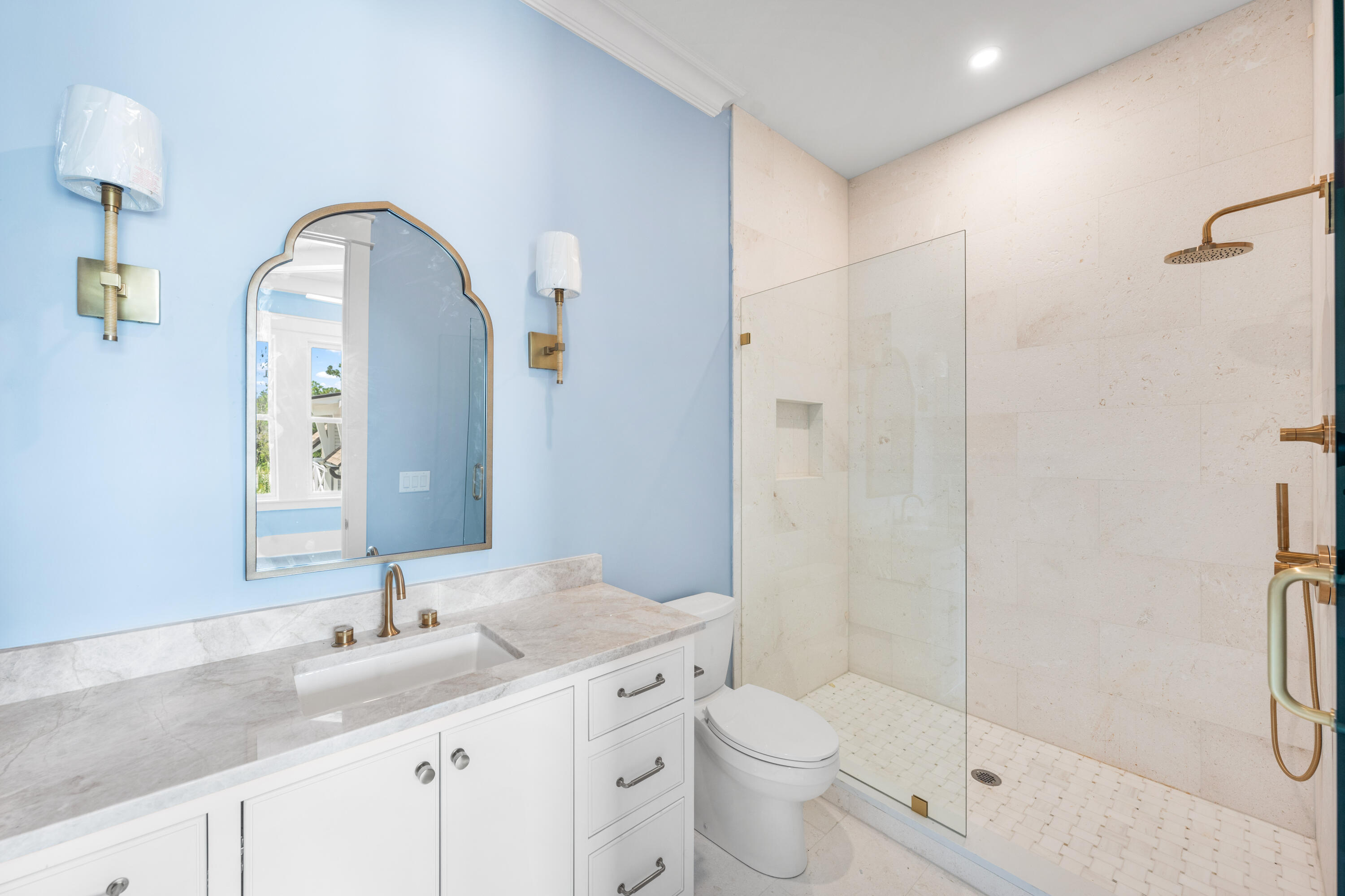 65 Morning Lgt Way Watersound, FL 32461 - Photo 25 of 59 a bathroom with a granite countertop sink a toilet and shower