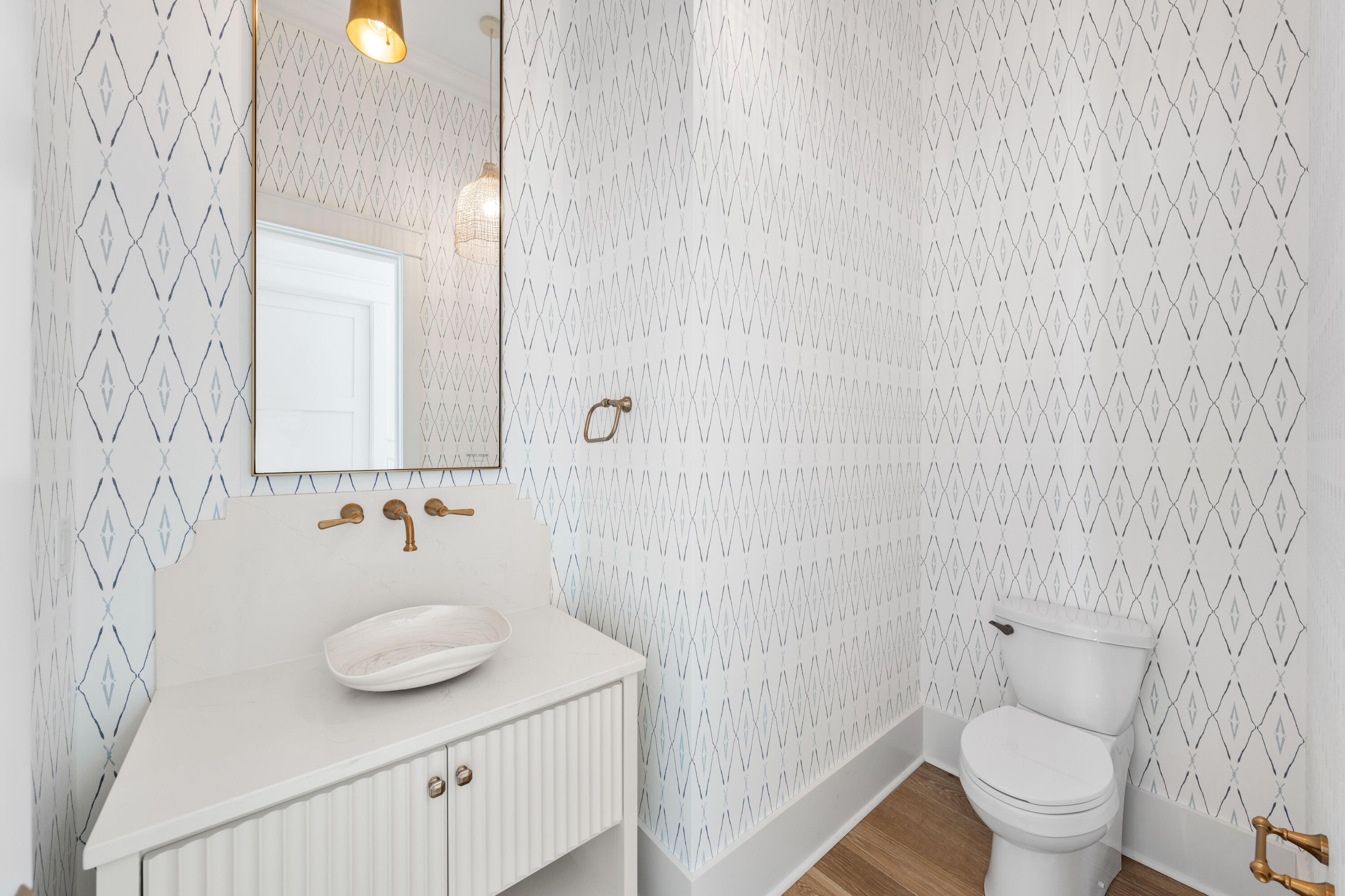 65 Morning Lgt Way Watersound, FL 32461 - Photo 26 of 59 a bathroom with a sink and a mirror