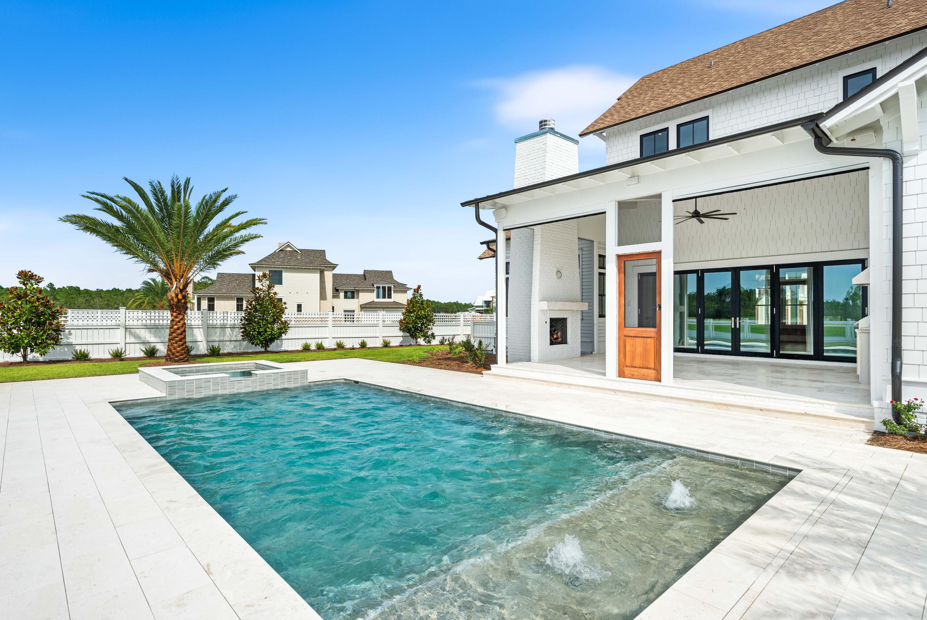 65 Morning Lgt Way Watersound, FL 32461 - Photo 3 of 59 a view of swimming pool with outdoor seating and a yard