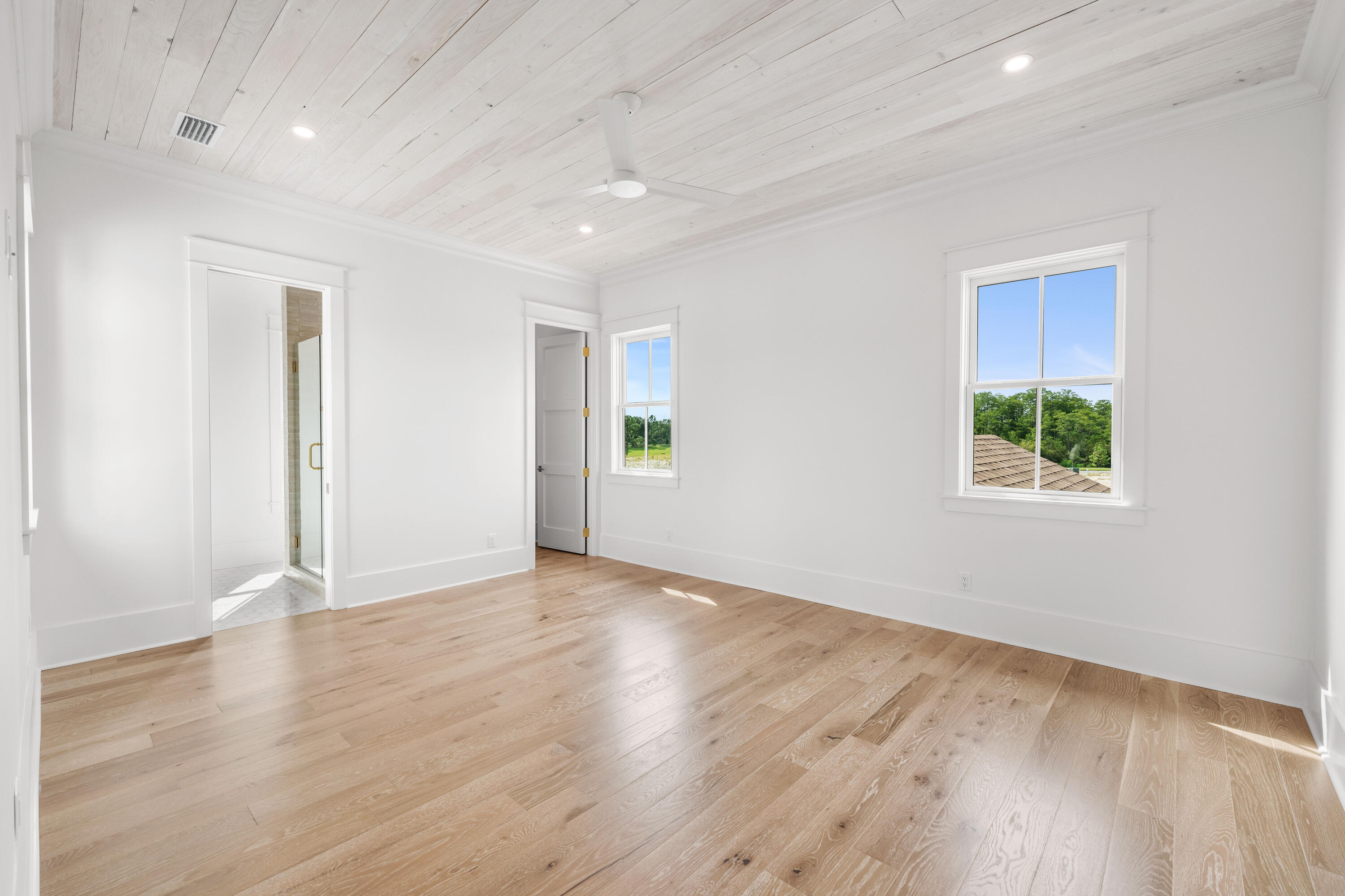 65 Morning Lgt Way Watersound, FL 32461 - Photo 31 of 59 an empty room with wooden floor and windows
