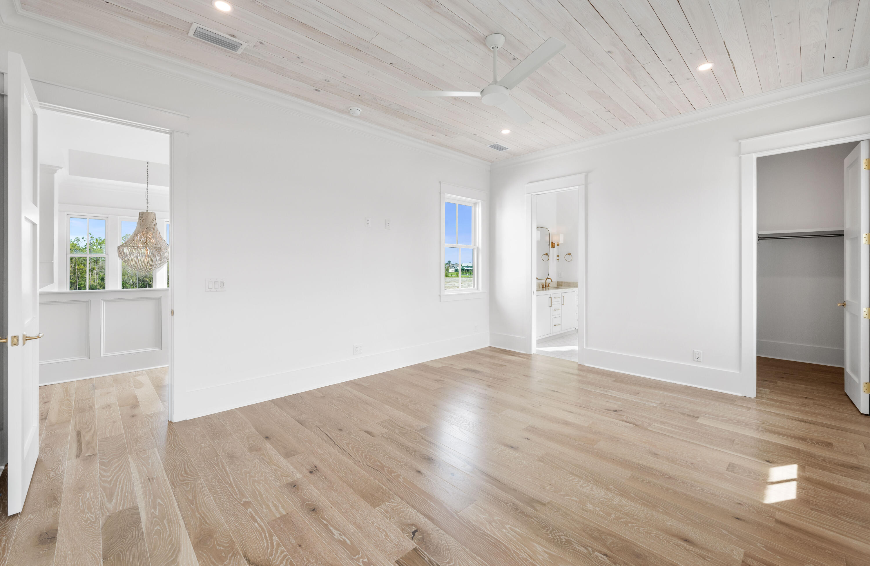 65 Morning Lgt Way Watersound, FL 32461 - Photo 32 of 59 wooden floor in an empty room with a window