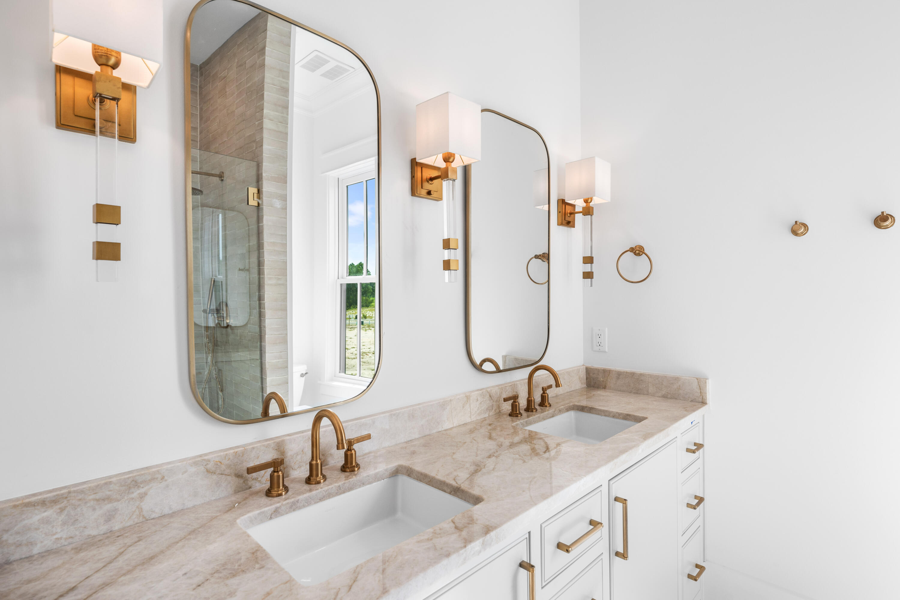 65 Morning Lgt Way Watersound, FL 32461 - Photo 33 of 59 a bathroom with a granite countertop sink and a mirror