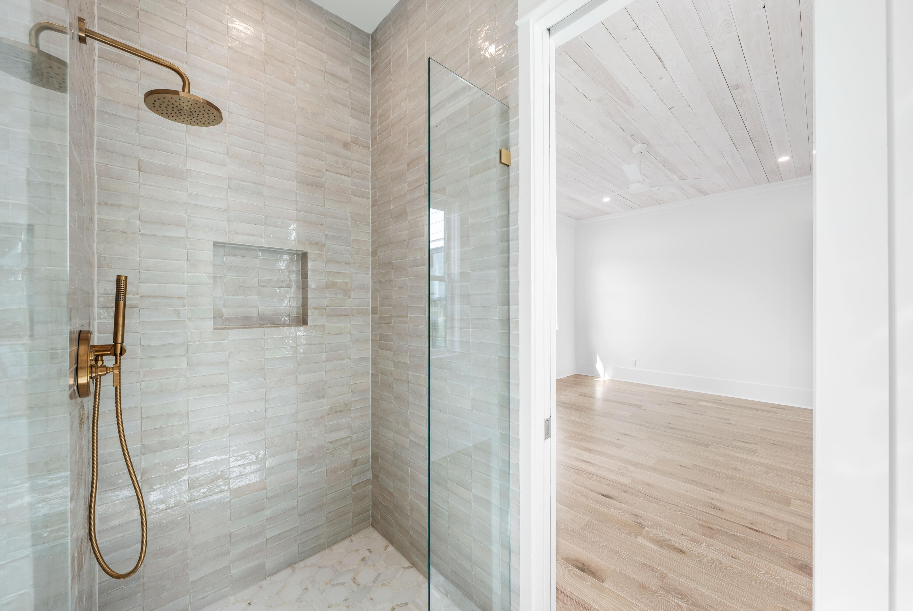 65 Morning Lgt Way Watersound, FL 32461 - Photo 35 of 59 a bathroom with a glass shower door