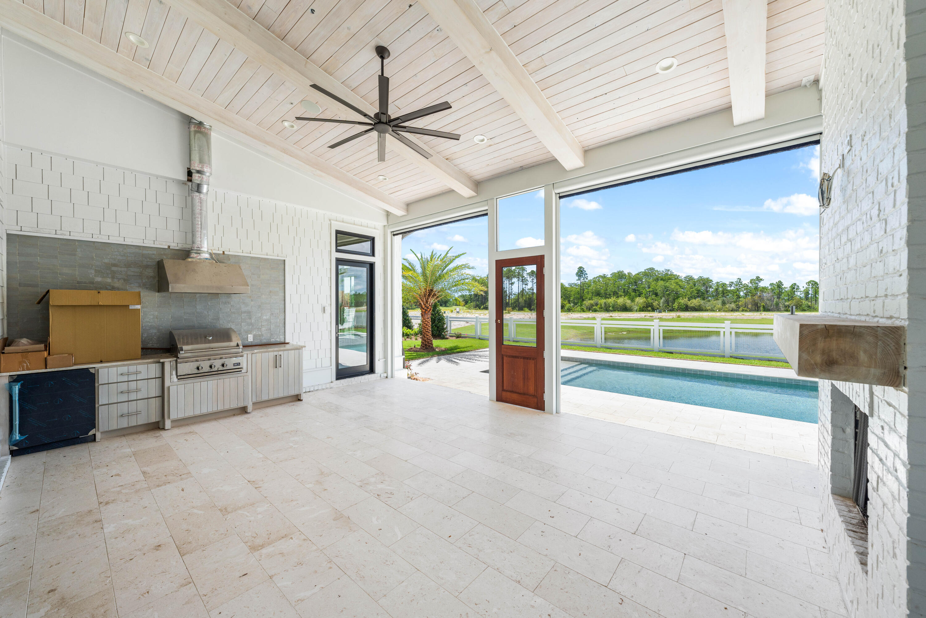 65 Morning Lgt Way Watersound, FL 32461 - Photo 44 of 59 a view of a kitchen with a sink and a large window