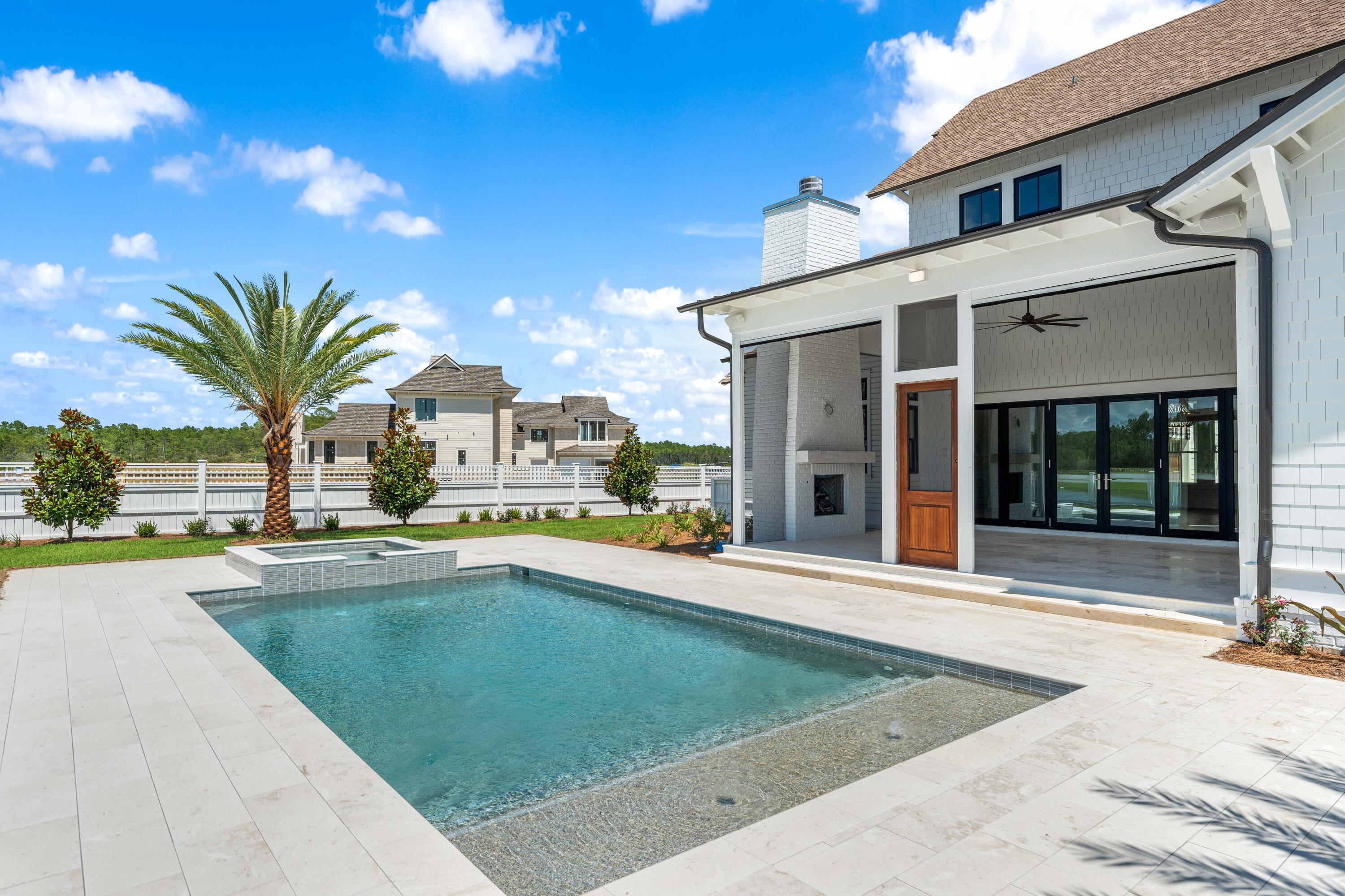 65 Morning Lgt Way Watersound, FL 32461 - Photo 45 of 59 a view of a house with swimming pool and sitting area