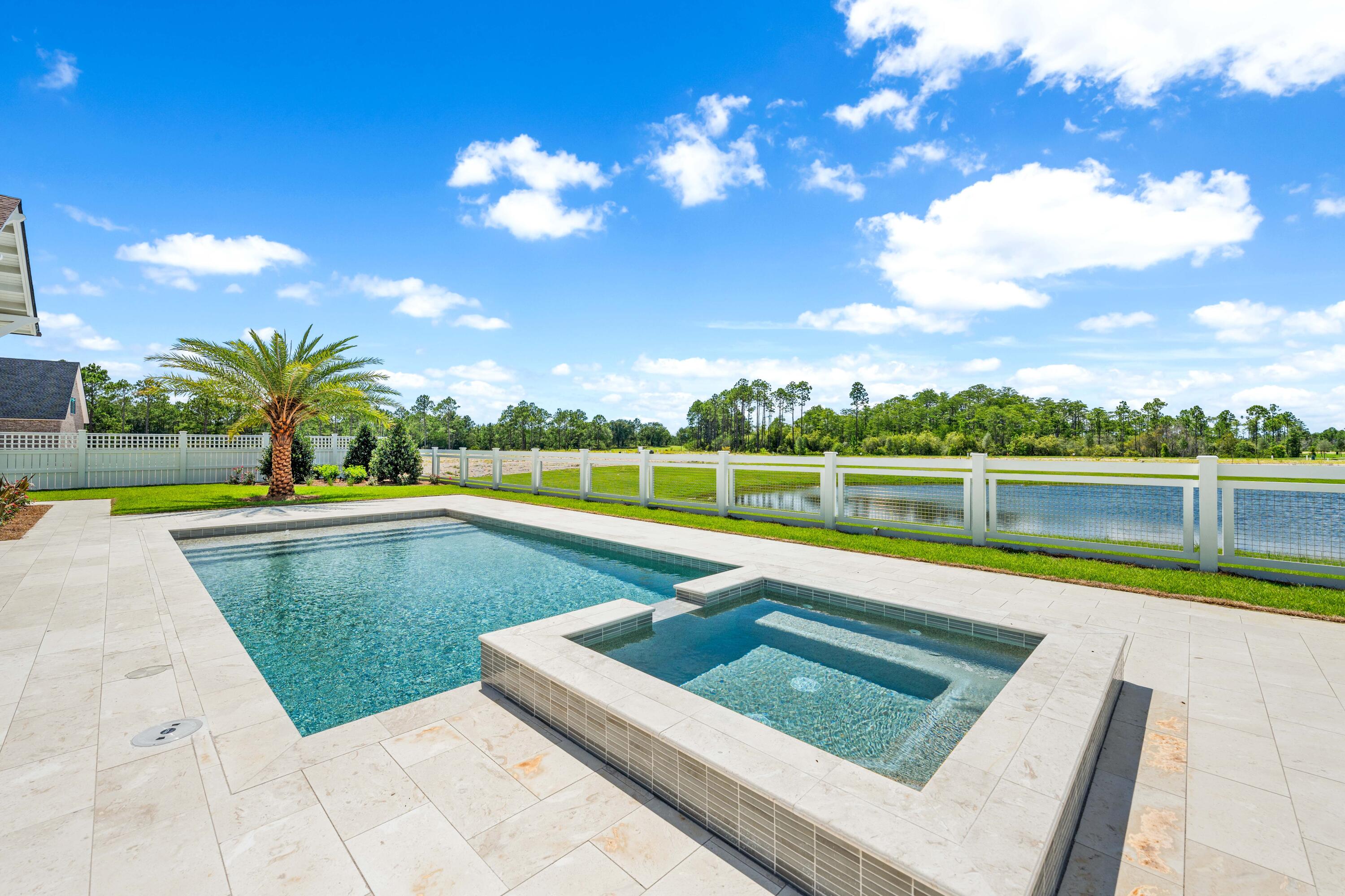 65 Morning Lgt Way Watersound, FL 32461 - Photo 49 of 59 a view of a swimming pool with a lounge chairs