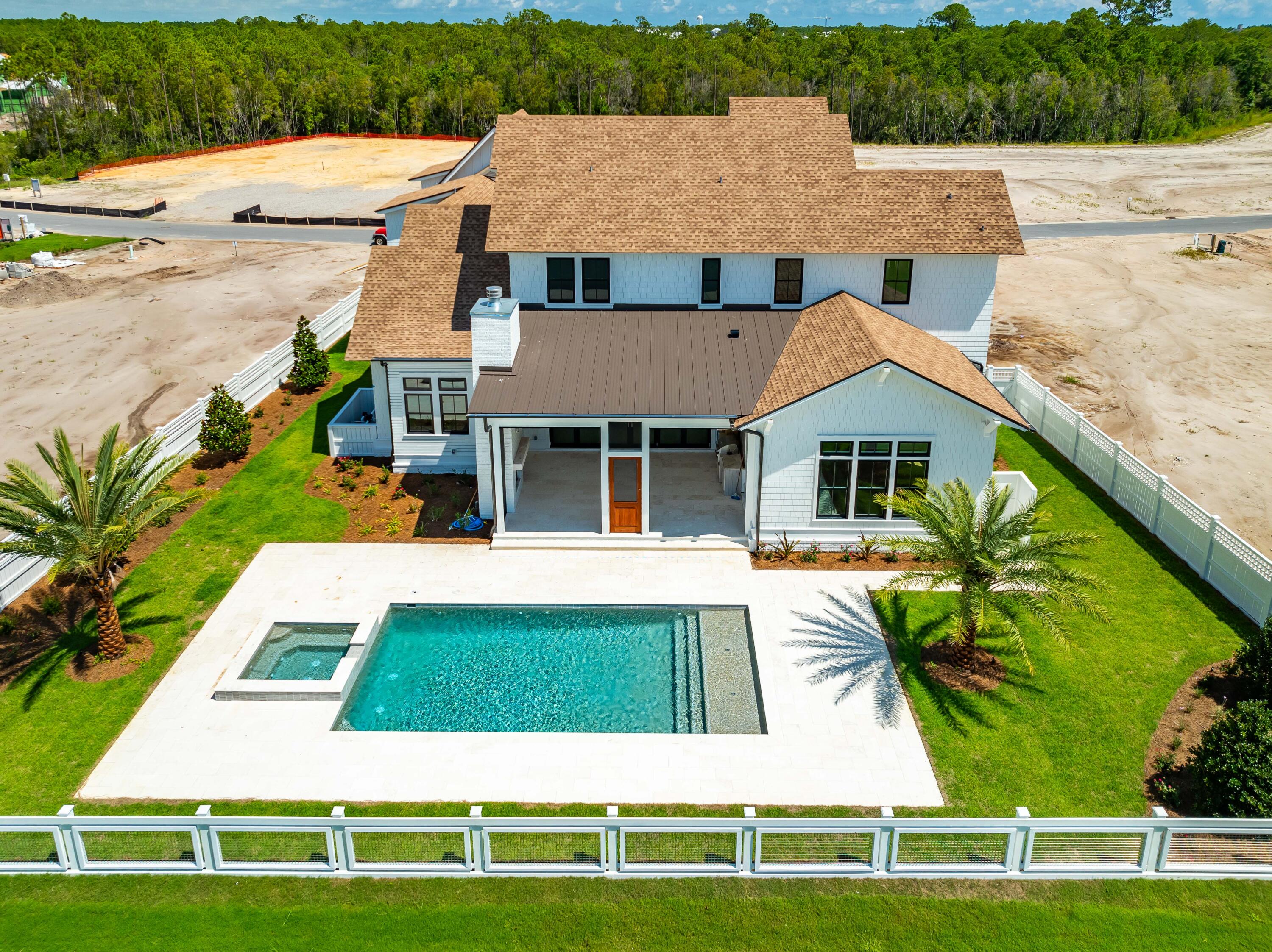 65 Morning Lgt Way Watersound, FL 32461 - Photo 51 of 59 a aerial view of a house with a swimming pool