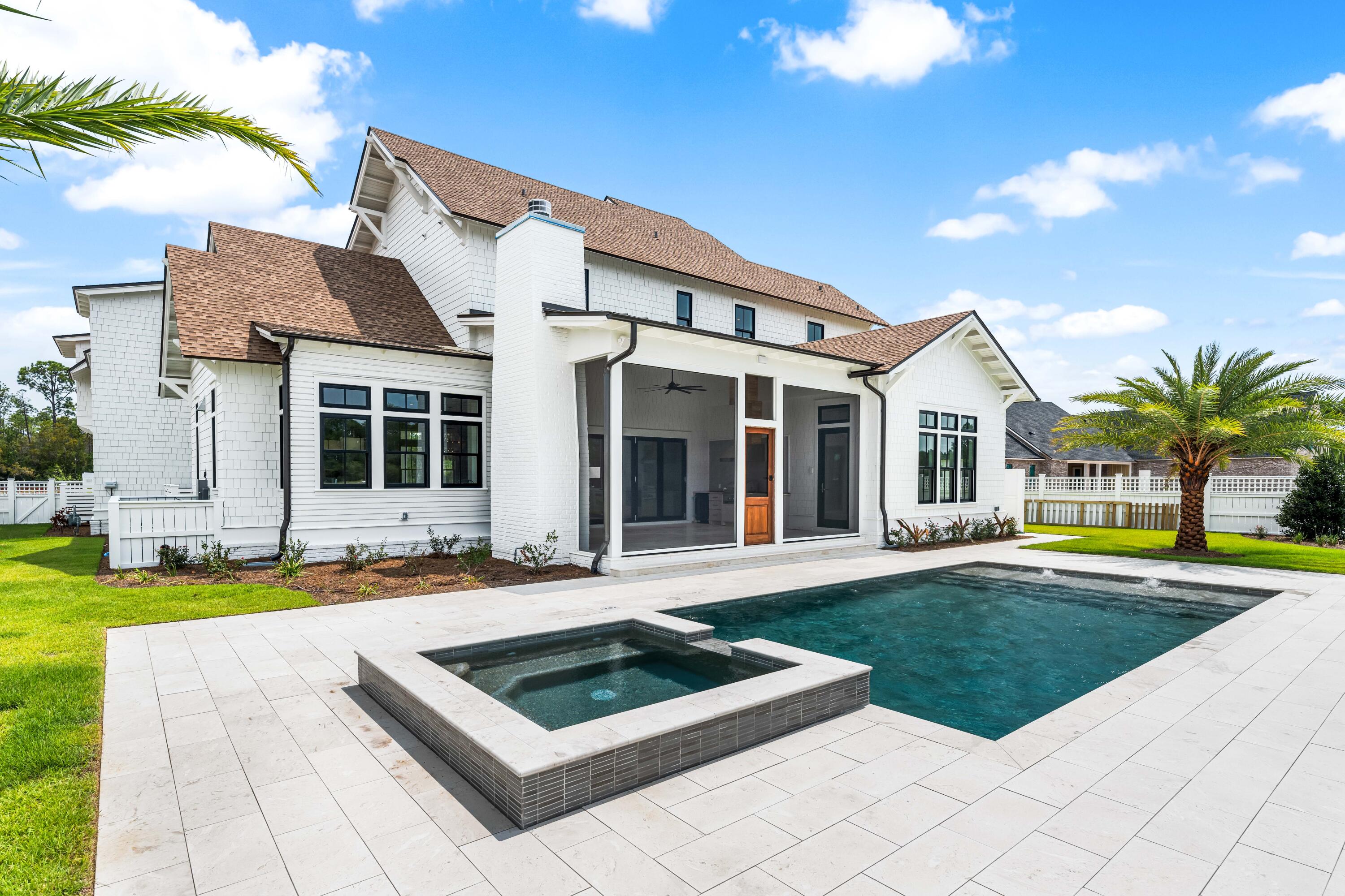 65 Morning Lgt Way Watersound, FL 32461 - Photo 53 of 59 a house with swimming pool in front of it