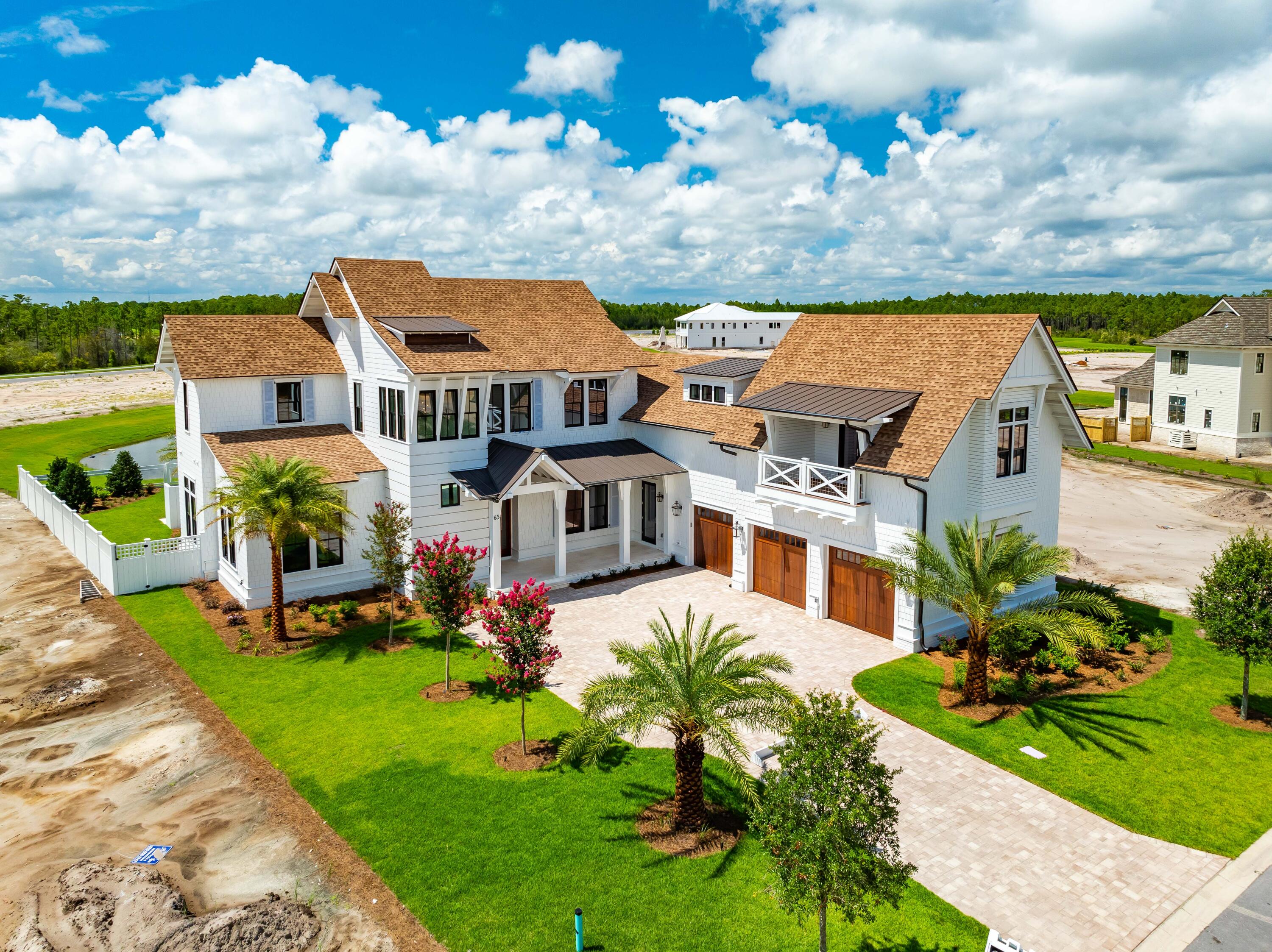 65 Morning Lgt Way Watersound, FL 32461 - Photo 54 of 59 a front view of a house with garden