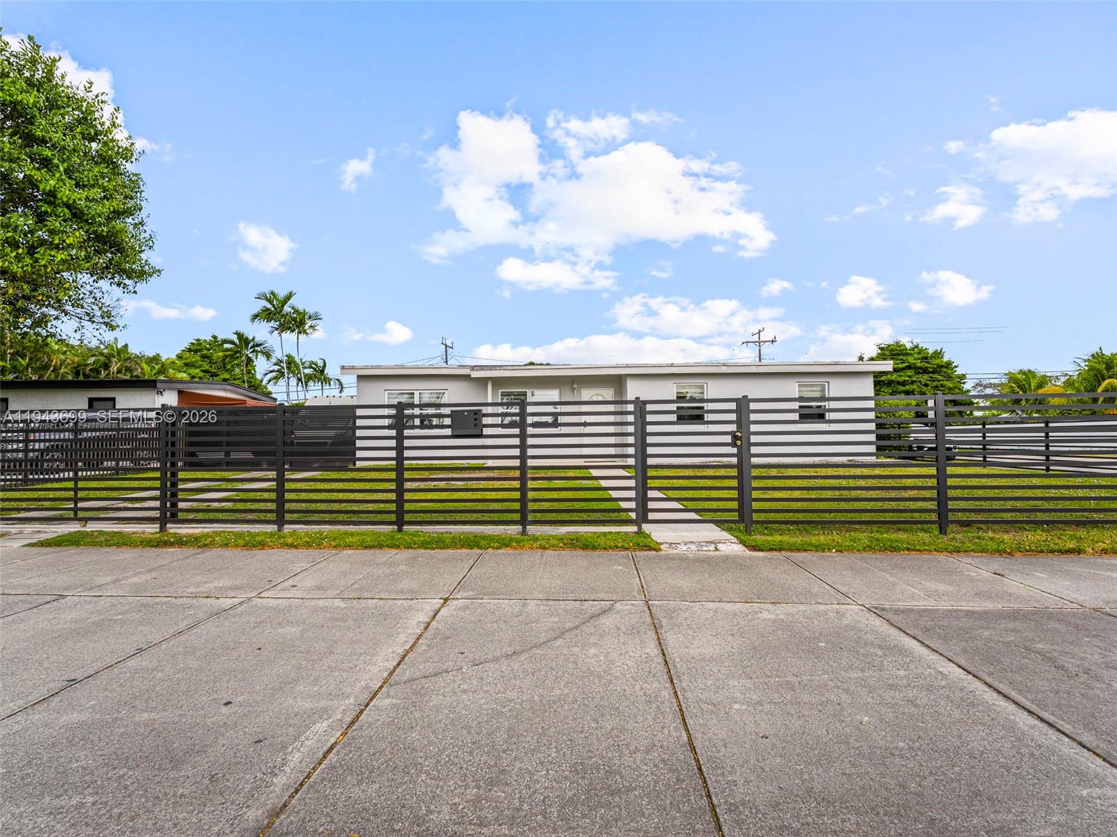 11401 Southwest 56th Street Miami, FL 33165 - Photo 34 of 37 a view of park with wooden fence