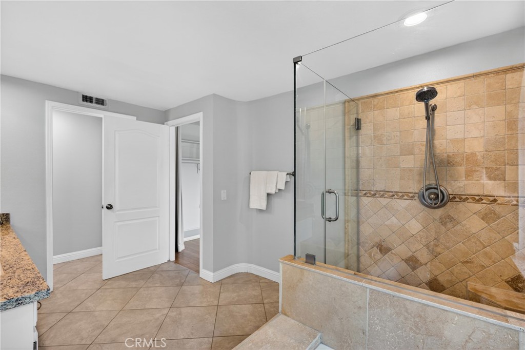 19468 Kilfinan Street Porter Ranch, CA 91326 - Photo 30 of 48 a bathroom with a shower and a sink