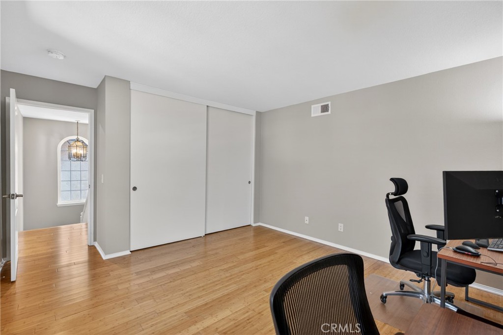 19468 Kilfinan Street Porter Ranch, CA 91326 - Photo 36 of 48 a view of a workspace with furniture and wooden floor