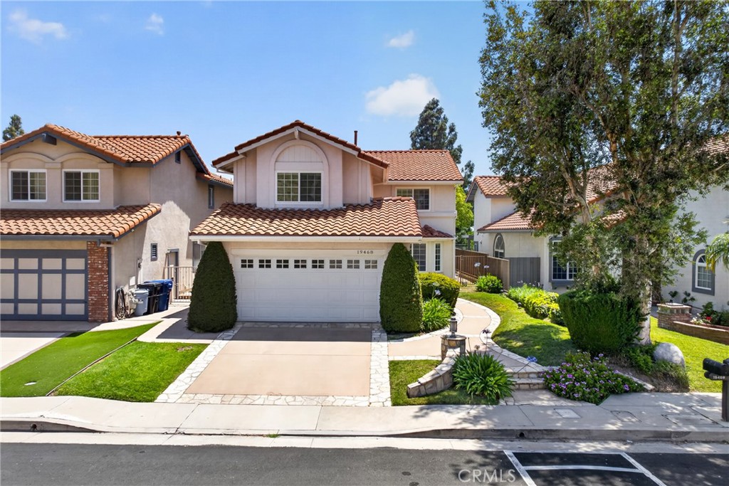 19468 Kilfinan Street Porter Ranch, CA 91326 - Photo 45 of 48 a front view of house with yard and green space