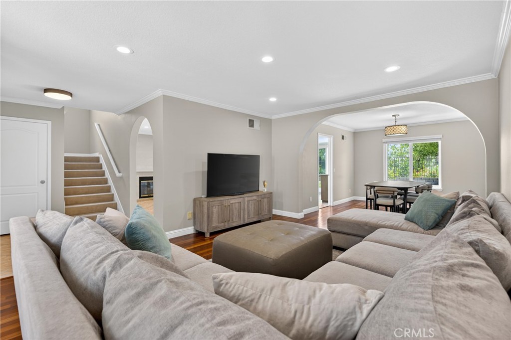 19468 Kilfinan Street Porter Ranch, CA 91326 - Photo 6 of 48 a living room with furniture and a flat screen tv