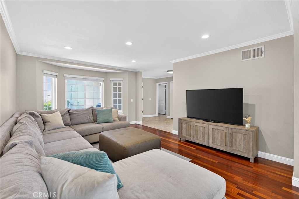 19468 Kilfinan Street Porter Ranch, CA 91326 - Photo 8 of 48 a living room with furniture and a flat screen tv