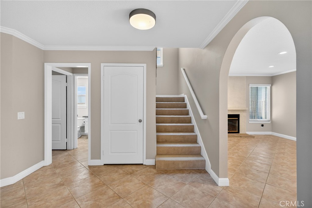 19468 Kilfinan Street Porter Ranch, CA 91326 - Photo 10 of 48 a view of a hallway with entryway wooden floor and front door