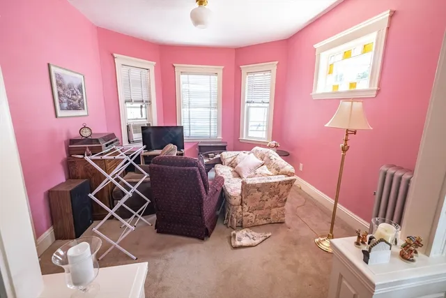 a bed room with a bed and a chair