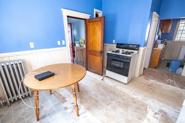 a view of kitchen island with furniture and wooden floor