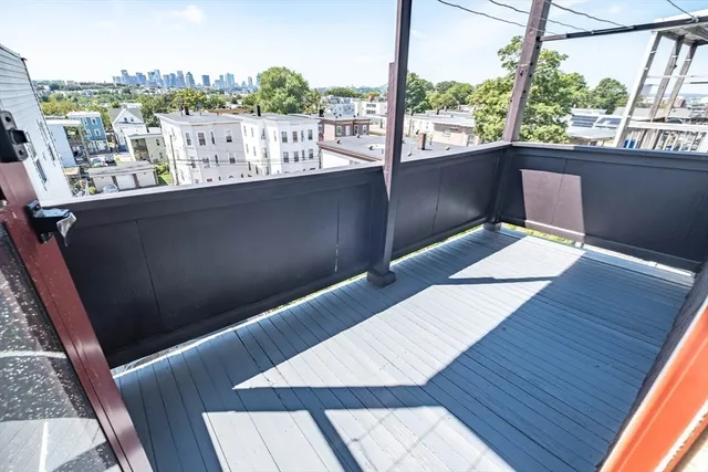 a living room with wooden floor and furniture