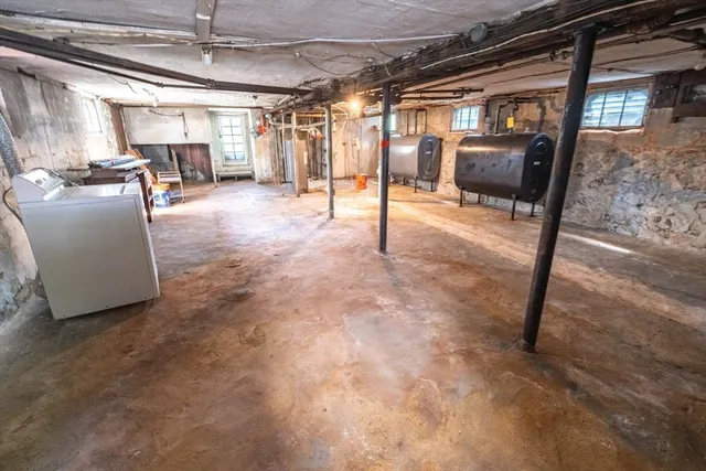 a view of a livingroom with furniture and a window