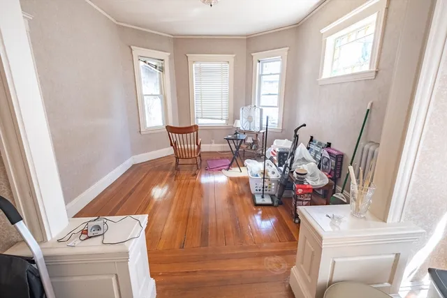 a view of a dining room with furniture window and wooden floor