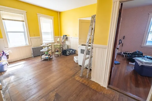 a view of a livingroom with furniture and a window
