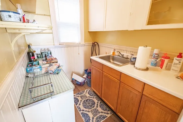 a utility room with sink dryer and washer