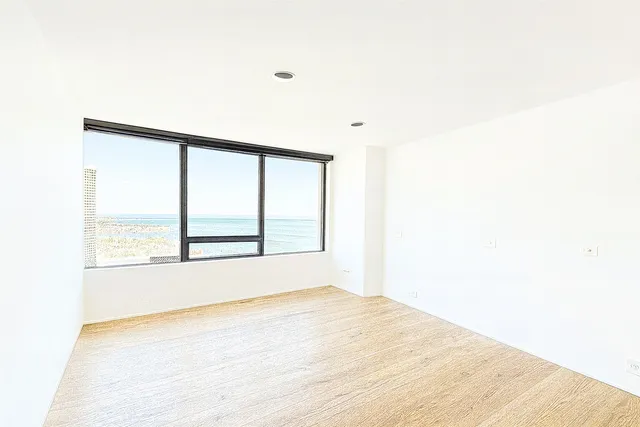 a view of an empty room with a window