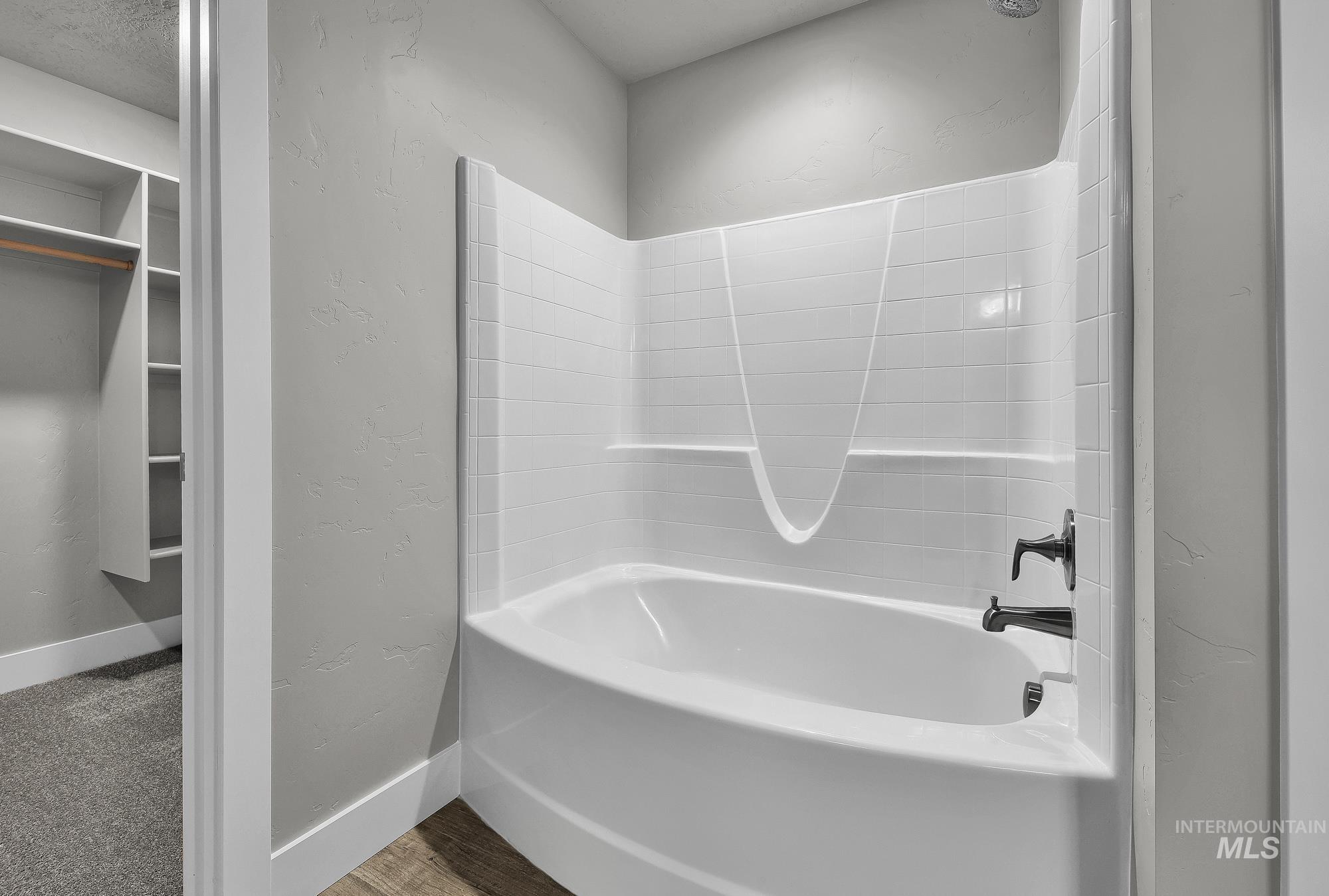 320 North 12th Parma, ID 83660 - Photo 25 of 34 White tub-shower combination with dark bronze fixtures