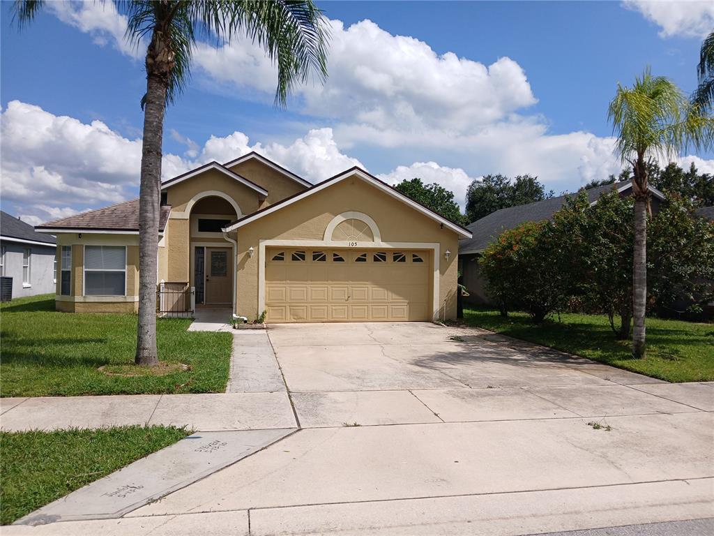 105 Andrews Road Sanford, FL 32773 - Photo 1 of 1 a front view of a house with a yard and garage