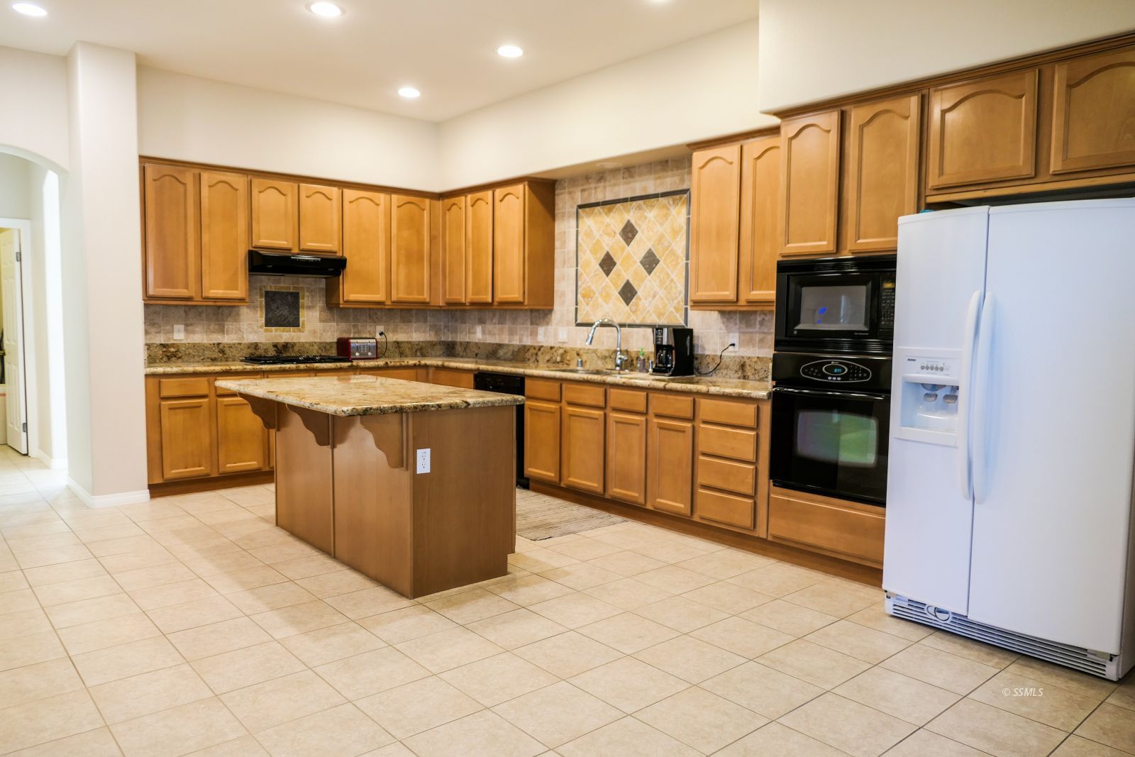 120 West Franklin Avenue Ridgecrest, CA 93555 - Photo 10 of 49 a kitchen with stainless steel appliances granite countertop a stove top oven a refrigerator a sink and dishwasher