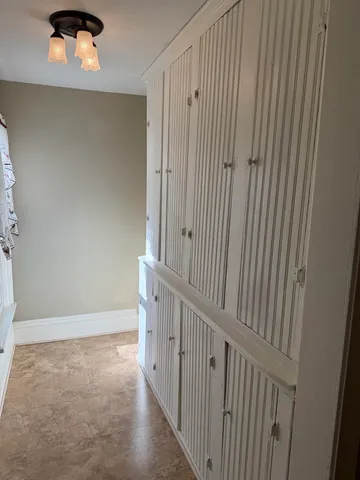 a view of a hallway with washer and dryer