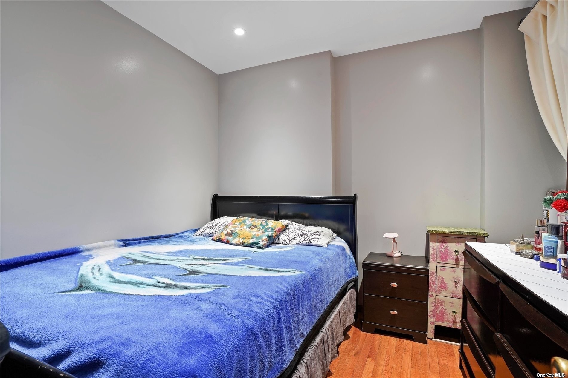 18-11 Centre Street Queens, NY 11385 - Photo 12 of 27 a bedroom with a bed and a dresser